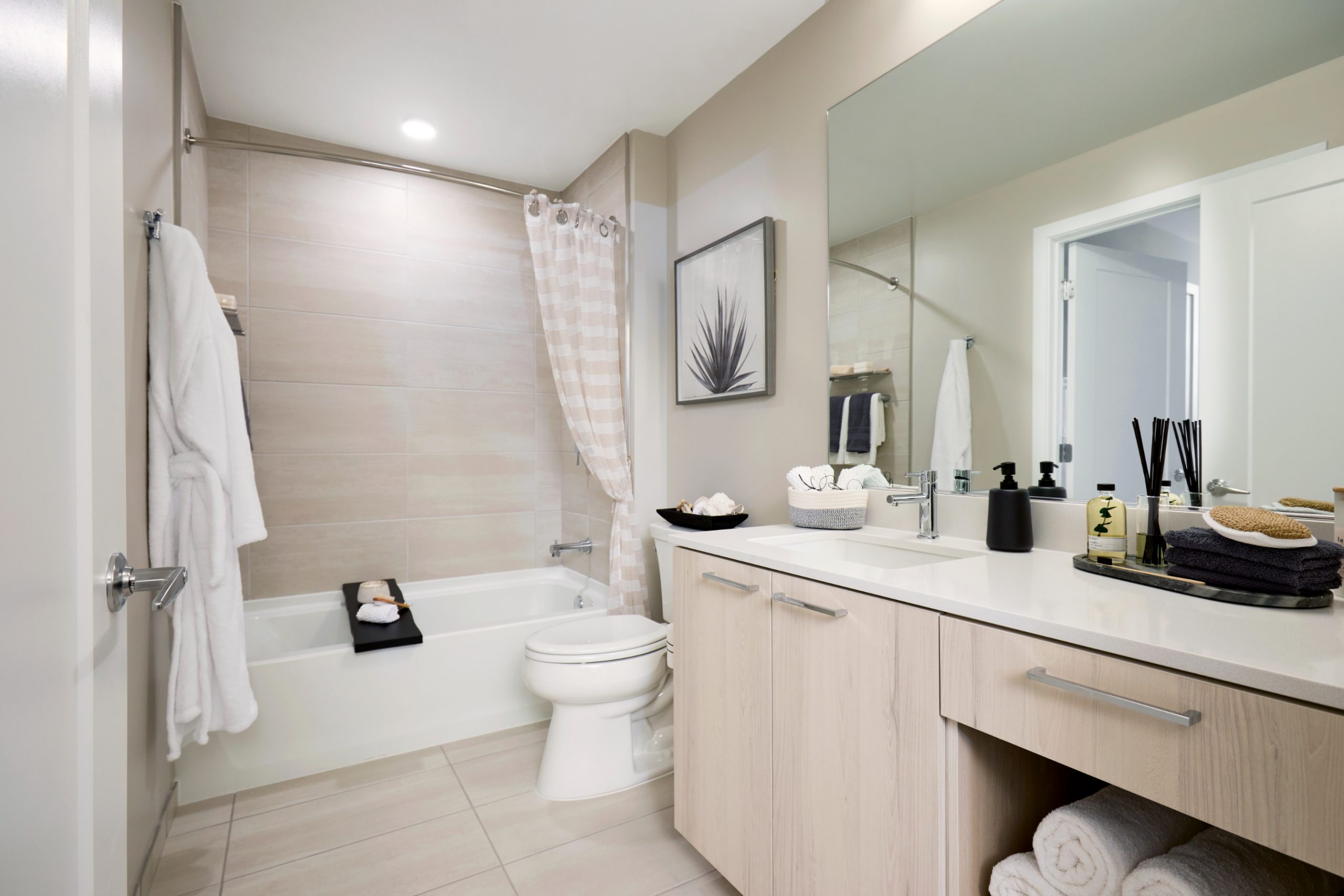 Bathrooms feature refined details, such as chrome fixtures and light cabinetry